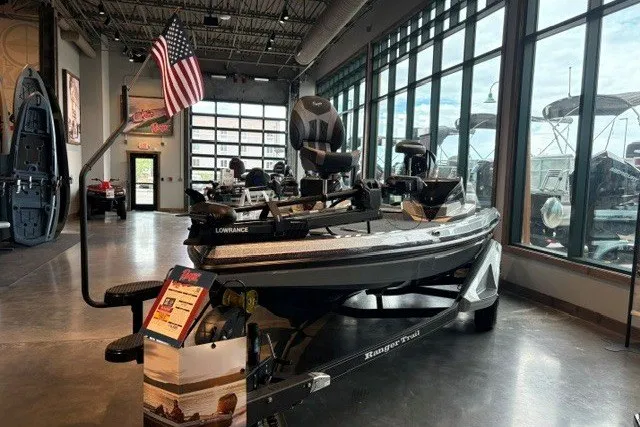 The Image of 2026 Ranger Z518 boat displayed in showroom with American flag. - 0