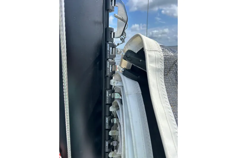 Slide: The Image of Close-up of Corsair 880 sailboat rigging and sail details, 2023 model. - 20