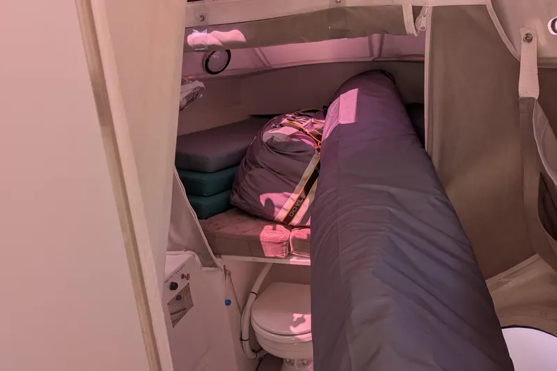 Slide: The Image of Interior cabin of 2023 Corsair 880 sailboat with storage and seating. - 25