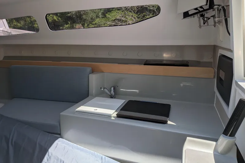 Slide: The Image of Interior of 2023 Corsair 880 sailboat, featuring sleek seating and modern amenities. - 26