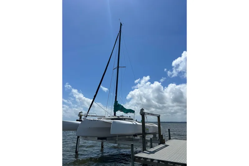 Slide: The Image of Sailboat Corsair 880, 2023 model, docked on a sunny day with blue skies. - 9