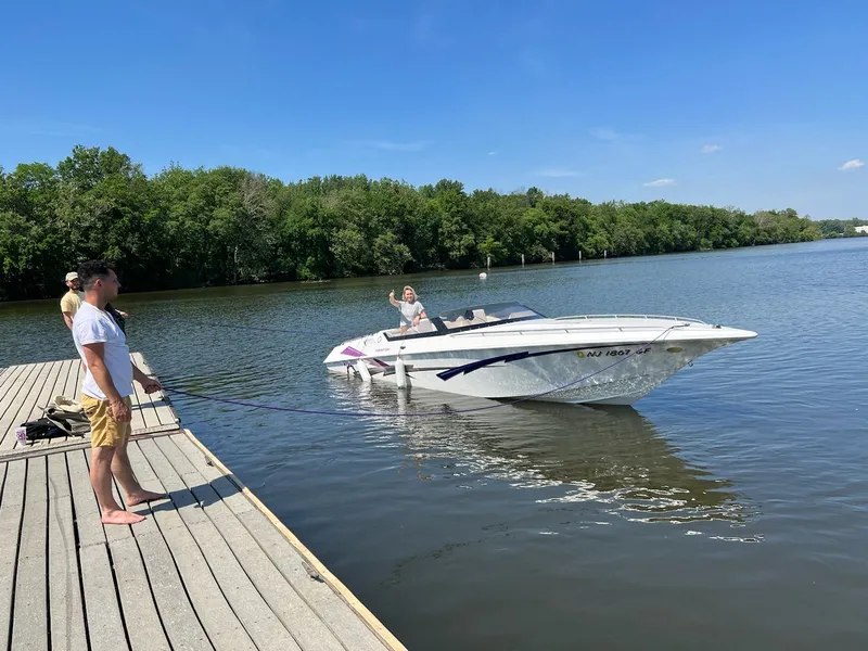 The Image of 1998 Fountain 27 Fever boat at dock with people. - 0