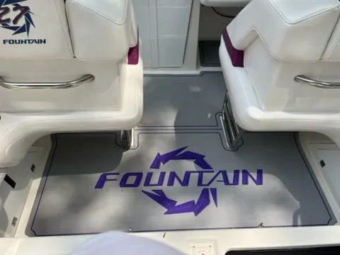 Slide: The Image of Interior of a 1998 Fountain 27 Fever boat with logo. - 8