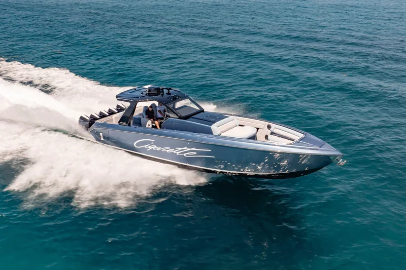 The Image of 2024 Cigarette 42' Auroris speedboat cruising on open blue water. - 1