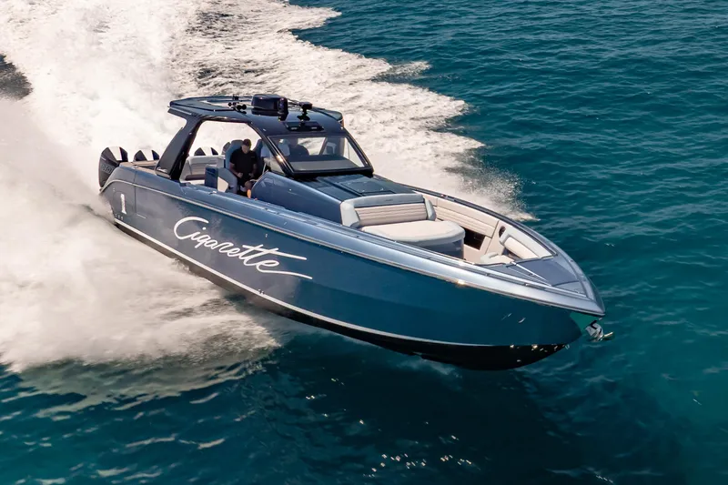 Slide: The Image of 2024 Cigarette 42' Auroris speedboat cruising on open water. - 11