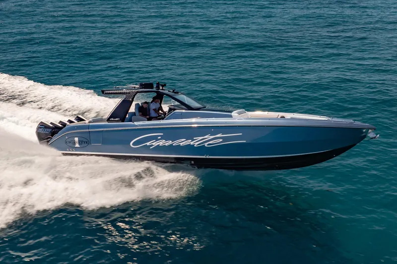 Slide: The Image of 2024 Cigarette 42' Auroris speedboat cruising on open water. - 12