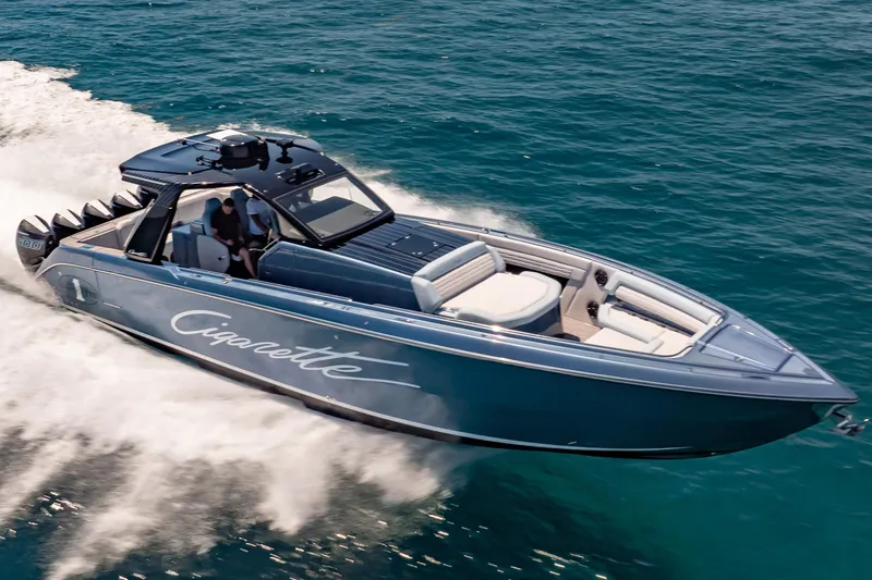 Slide: The Image of 2024 Cigarette 42' Auroris speedboat cruising on open water. - 13