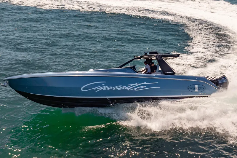 Slide: The Image of 2024 Cigarette 42' Auroris speedboat cruising on open water. - 15