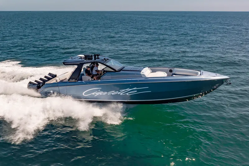 Slide: The Image of 2024 Cigarette 42' Auroris speedboat cruising on open water. - 17