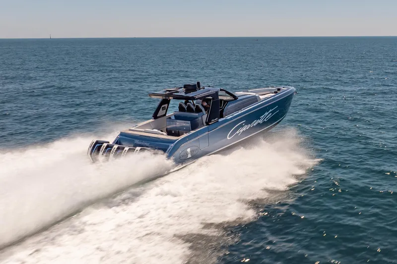 Slide: The Image of 2024 Cigarette 42' Auroris speedboat cruising on open water. - 18