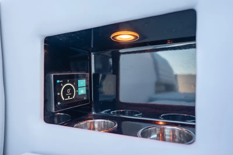Slide: The Image of 2024 Cigarette 42' Auroris interior with digital display and cup holders. - 24