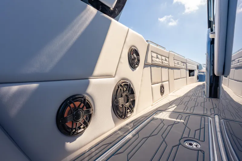 Slide: The Image of 2024 Cigarette 42' Auroris boat interior with sleek design and integrated speakers. - 29