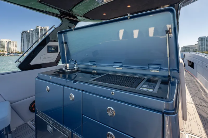 Slide: The Image of Luxury outdoor kitchen on 2024 Cigarette 42' Auroris yacht, featuring grill and sink. - 30