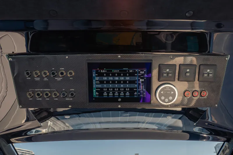 Slide: The Image of Control panel of 2024 Cigarette 42' Auroris boat with digital display and switches. - 37