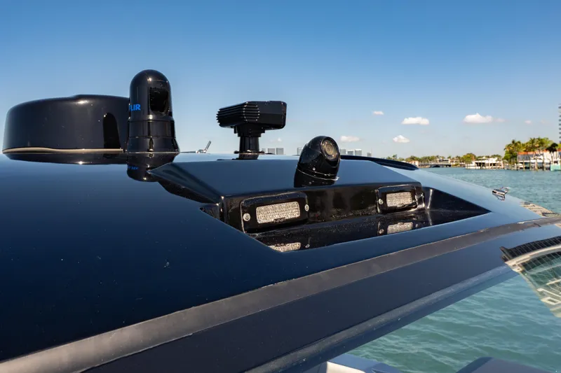Slide: The Image of 2024 Cigarette 42' Auroris boat with advanced navigation equipment on deck. - 44
