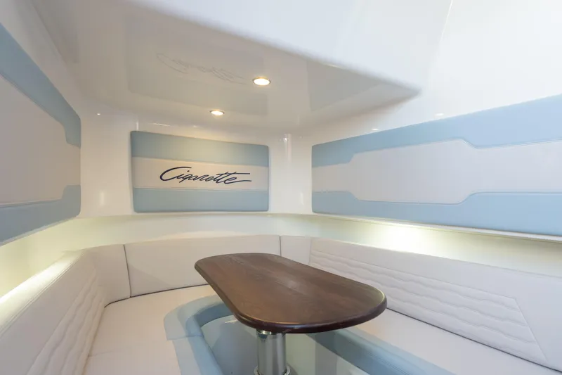 Slide: The Image of Interior of 2024 Cigarette 42' Auroris boat with sleek seating and wooden table. - 46
