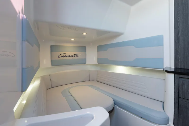 Slide: The Image of Luxurious interior of 2024 Cigarette 42' Auroris boat with elegant seating and ambient lighting. - 48