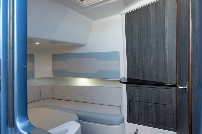 Slide: The Image of Interior of 2024 Cigarette 42' Auroris boat, featuring modern seating and cabinetry. - 49