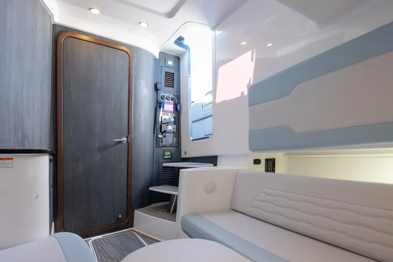 Slide: The Image of Interior of 2024 Cigarette 42' Auroris boat, featuring modern seating and control panel. - 50