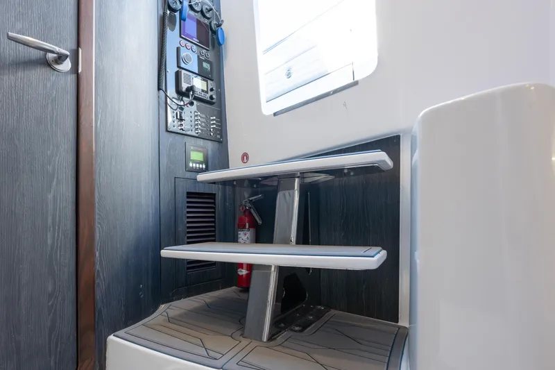 Slide: The Image of Interior of 2024 Cigarette 42' Auroris boat with control panel and steps. - 51