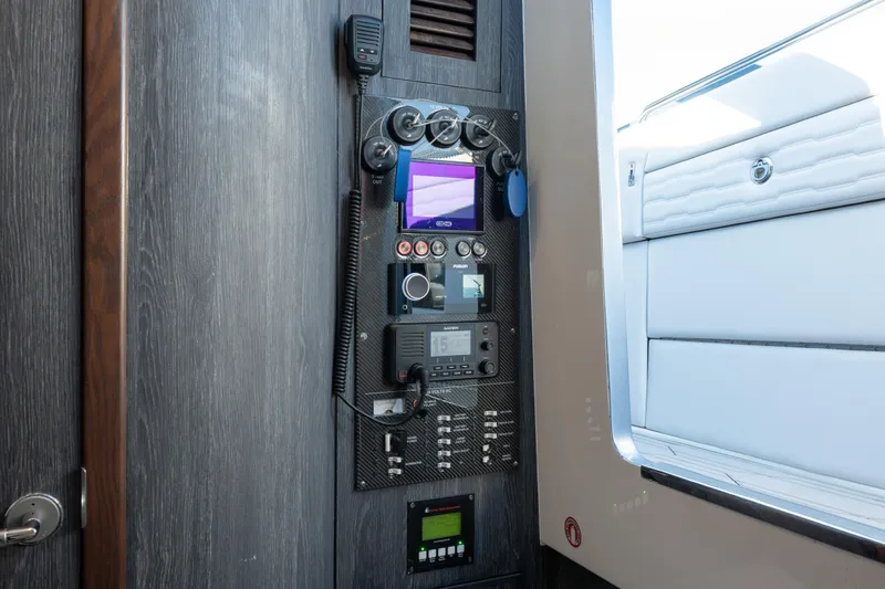 Slide: The Image of Control panel of 2024 Cigarette 42' Auroris boat with navigation and communication equipment. - 52