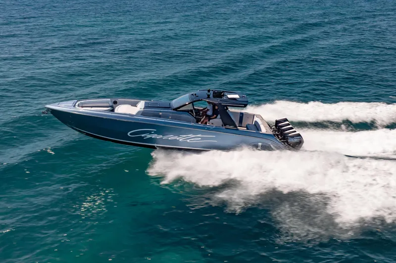 Slide: The Image of 2024 Cigarette 42' Auroris speedboat cruising on open water. - 6