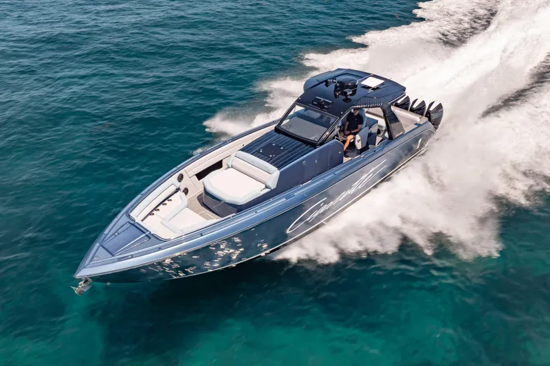 Slide: The Image of 2024 Cigarette 42' Auroris speedboat cruising on clear blue water. - 7