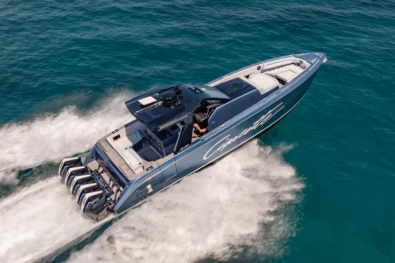 Slide: The Image of 2024 Cigarette 42' Auroris speedboat cruising on clear blue water. - 9