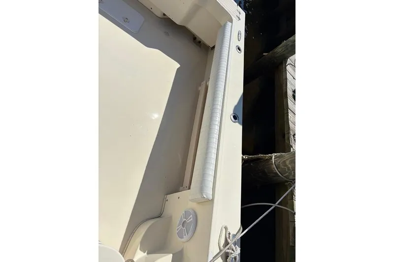 Slide: The Image of 2008 Parker 2510 XL Walkaround boat deck with speaker and railing. - 17