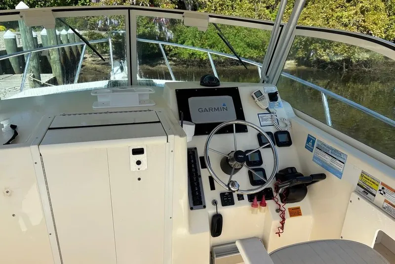 Slide: The Image of Helm of 2008 Parker 2510 XL Walkaround with Garmin navigation system and steering wheel. - 18