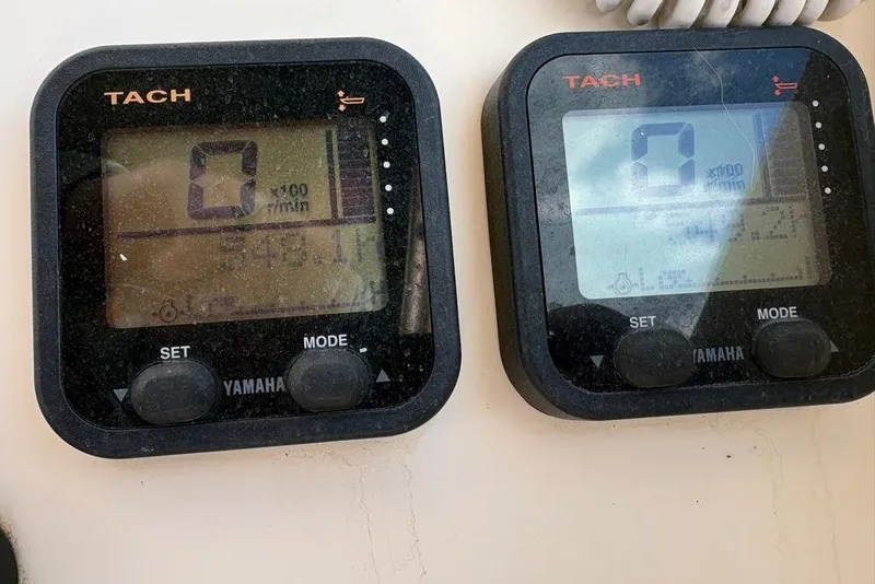Slide: The Image of Yamaha tachometers on a 2008 Parker 2510 XL Walkaround boat dashboard. - 21