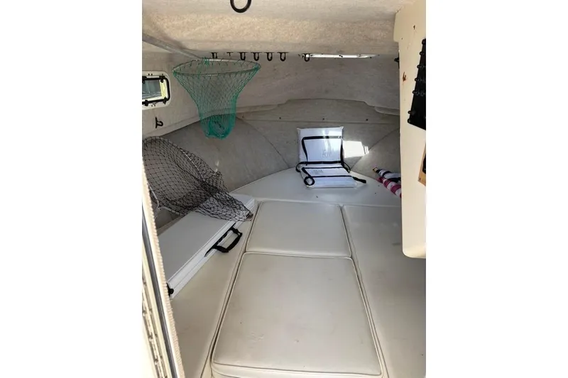 Slide: The Image of Interior cabin of 2008 Parker 2510 XL Walkaround boat with fishing nets and seating. - 26