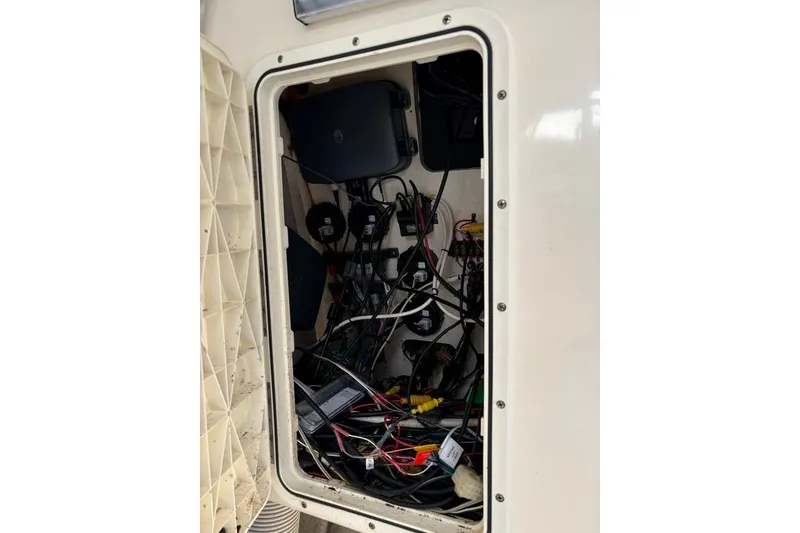 Slide: The Image of Electrical wiring compartment of a 2008 Parker 2510 XL Walkaround boat. - 27