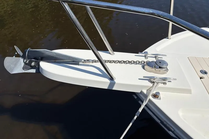 Slide: The Image of Bow of 2008 Parker 2510 XL Walkaround with anchor and chain in water. - 28