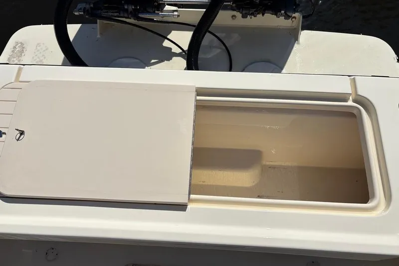 Slide: The Image of Open storage compartment on a 2008 Parker 2510 XL Walkaround boat. - 9