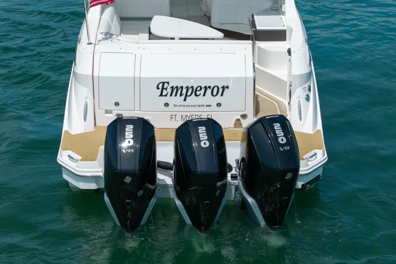Slide: The Image of 2024 Sea Ray Sundancer 320 Outboard with triple Mercury 250 V8 engines on water. - 15