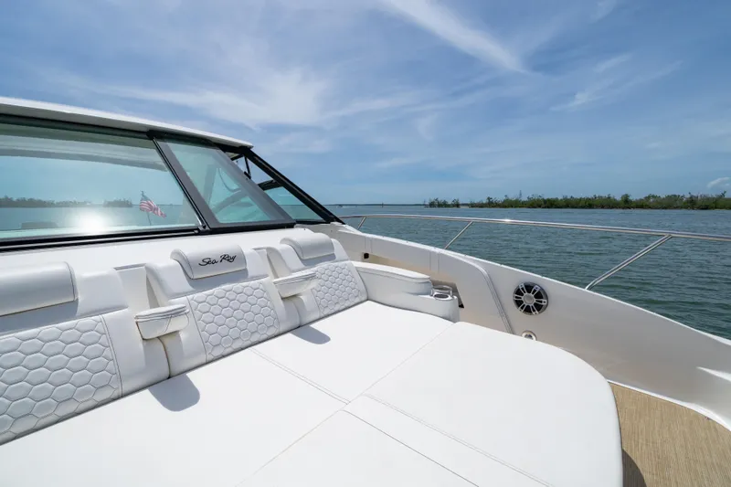 Slide: The Image of 2024 Sea Ray Sundancer 320 Outboard, luxurious seating, scenic water view. - 37
