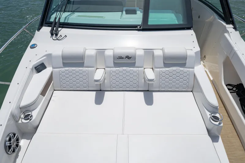 Slide: The Image of 2024 Sea Ray Sundancer 320 Outboard, luxurious white seating on deck. - 39