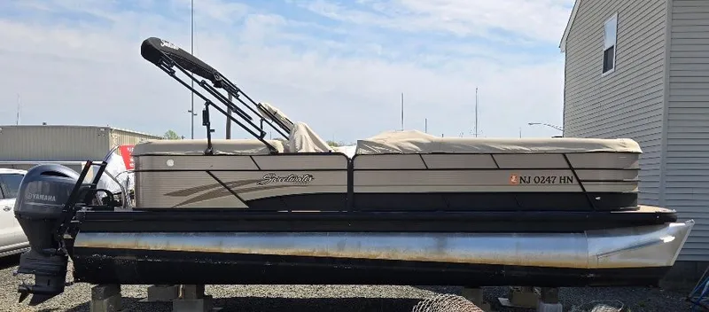 The Image of 2019 Godfrey Sweetwater 2386 Coastal tritoon parked outdoors. - 0