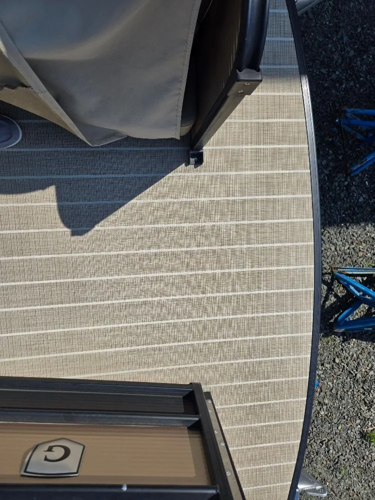 Slide: The Image of Deck of a 2019 Godfrey Sweetwater 2386 Coastal tritoon boat. - 14