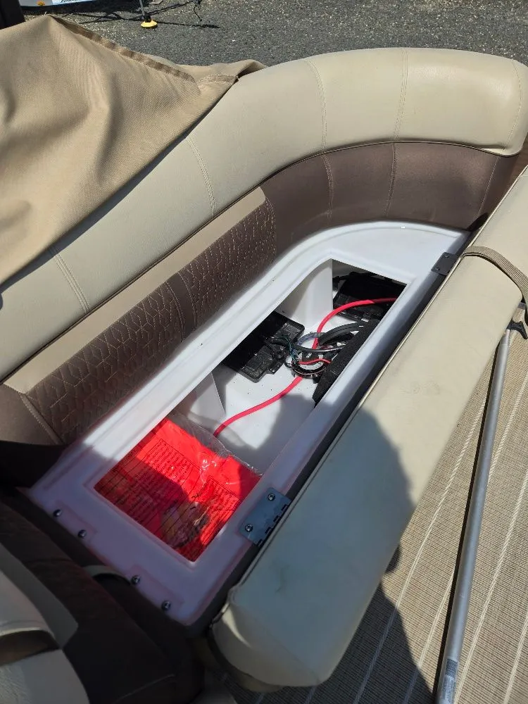 Slide: The Image of Interior of 2019 Godfrey Sweetwater 2386 Coastal Tritoon with storage compartment. - 16