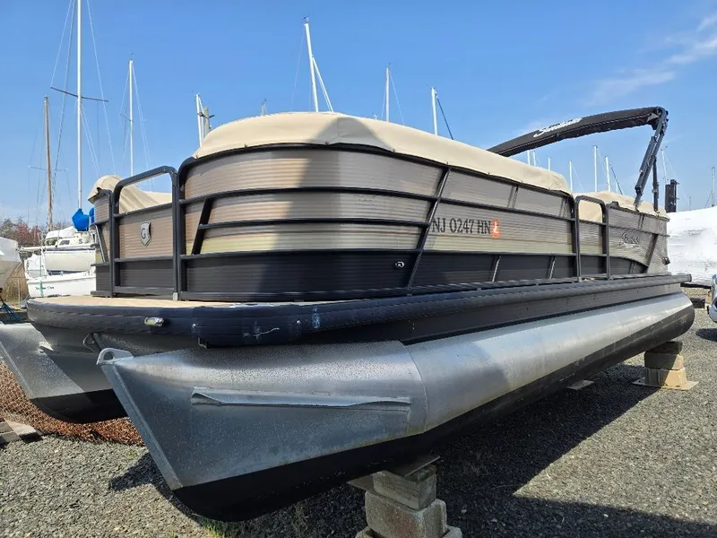 Slide: The Image of 2019 Godfrey Sweetwater 2386 Coastal tritoon stored on land. - 2