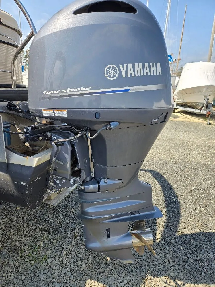 Slide: The Image of Yamaha outboard motor on a 2019 Godfrey Sweetwater 2386 Coastal tritoon. - 23