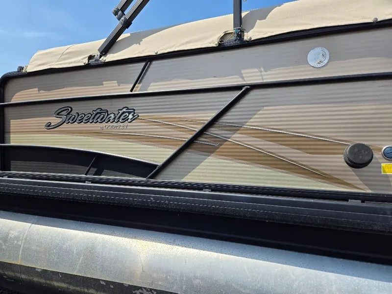 Slide: The Image of 2019 Godfrey Sweetwater 2386 Coastal Tritoon side view. - 25