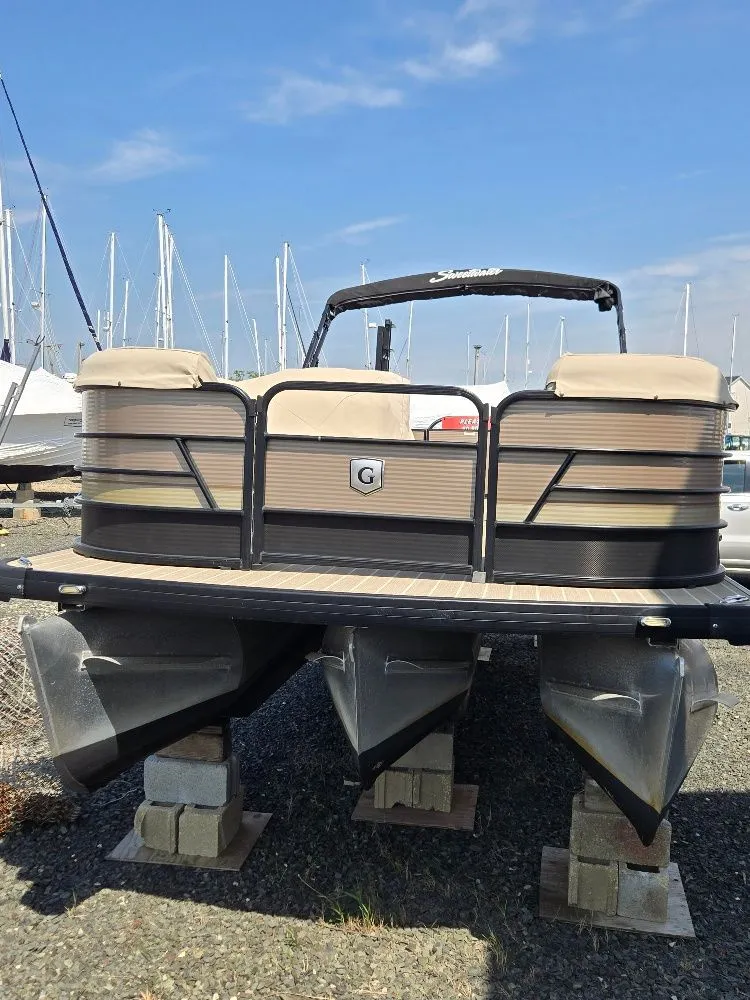 Slide: The Image of 2019 Godfrey Sweetwater 2386 Coastal tritoon docked at marina. - 7