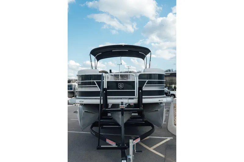 Slide: The Image of 2023 Godfrey Sweetwater 2286 SB pontoon boat on trailer under blue sky. - 3