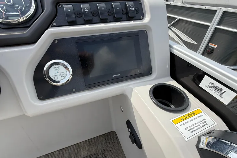 Slide: The Image of Dashboard of 2023 Godfrey Sweetwater 2286 SB boat with Garmin display and controls. - 7