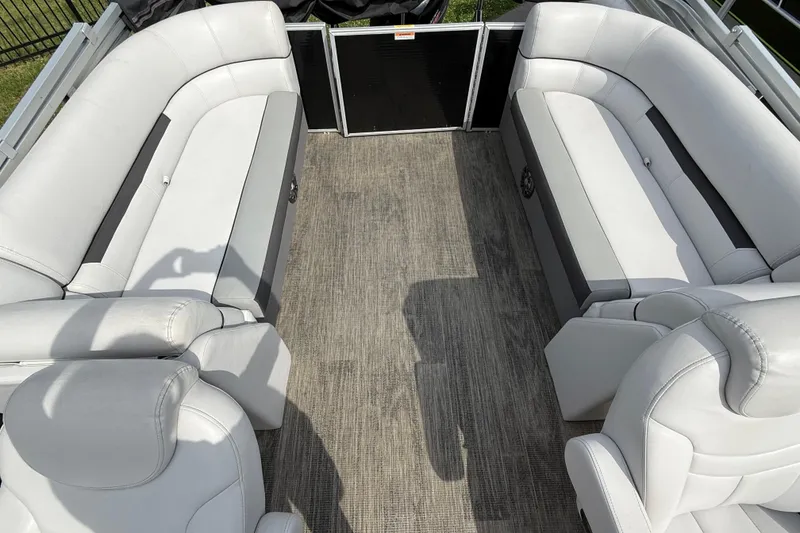 Slide: The Image of 2023 Godfrey Sweetwater 2286 SB pontoon boat interior with white seating and gray flooring. - 8