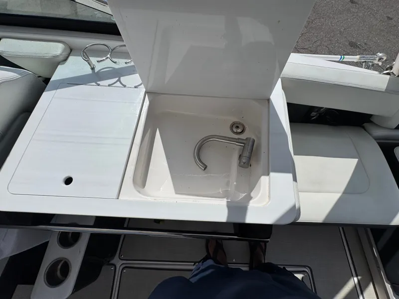 Slide: The Image of Regal 29 OBX 2021 boat kitchenette with sink and faucet. - 10