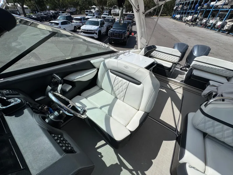 Slide: The Image of Interior of a 2021 Regal 29 OBX boat with luxurious seating. - 12